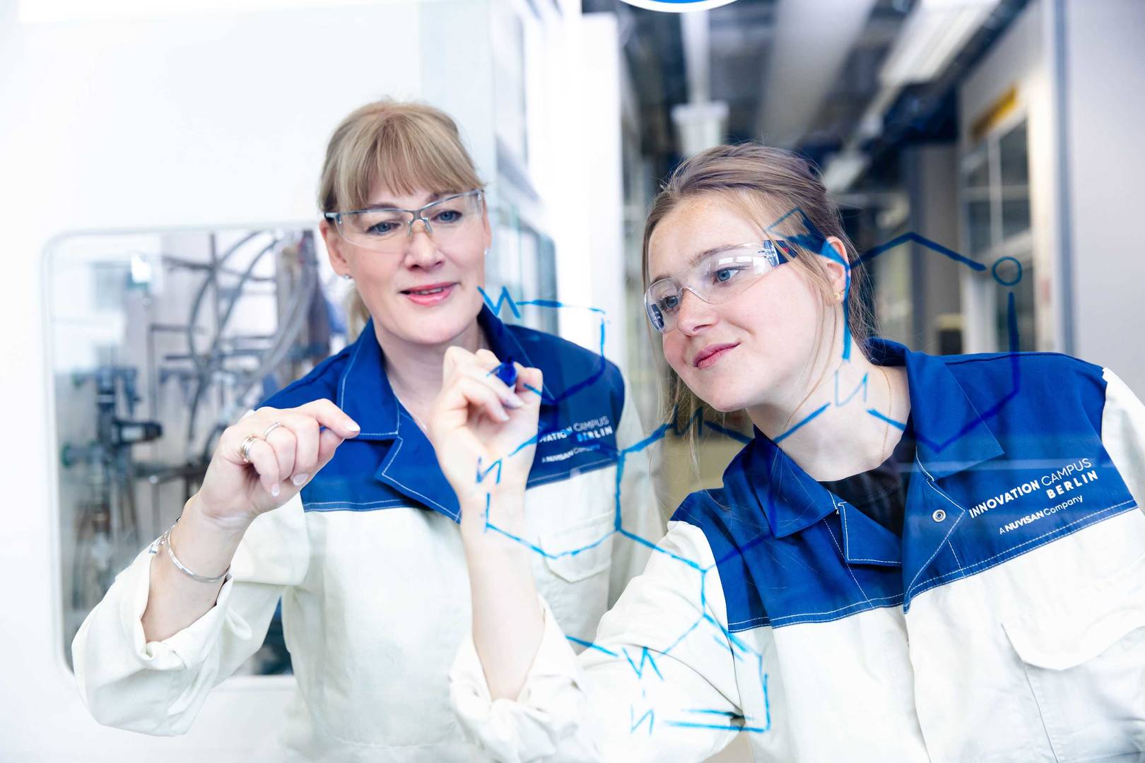 Two scientists discussing a chemical reaction